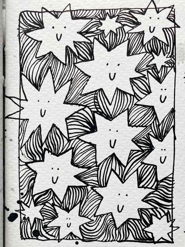 Details einer Skizzenbuchseite von Tabea Heinicker: Mit Feder und schwarzer Tusche gezeichnete Sterne mit und ohne Schweif