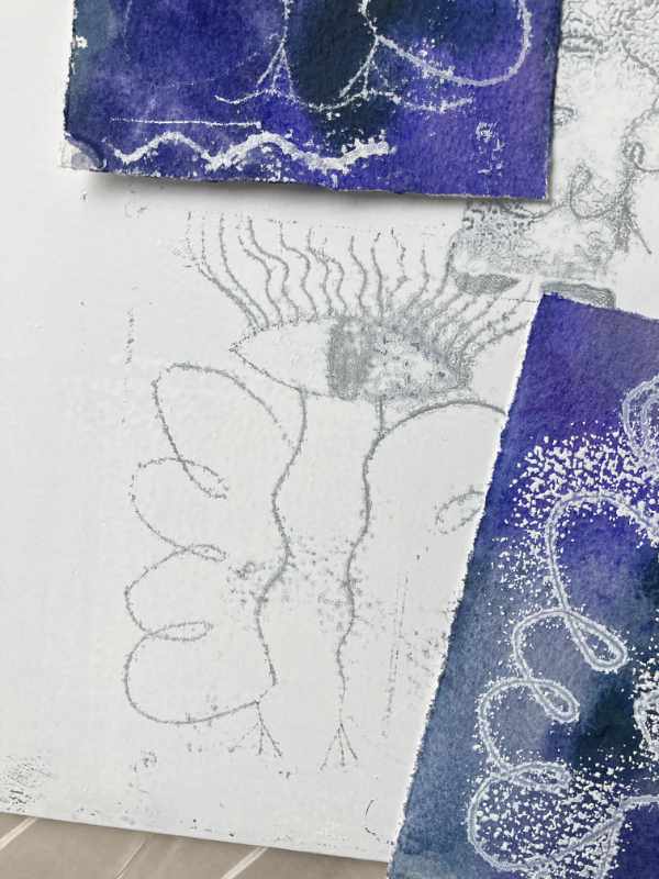 Weiß eingewalzte Glasscheibe, die schon gedruckt hat. Der Engel ist quasi herausgedruckt, an der Stelle ist keine Farbe mehr. Baer Weiß druckt schlecht. die Engel werden blass und rauschig.