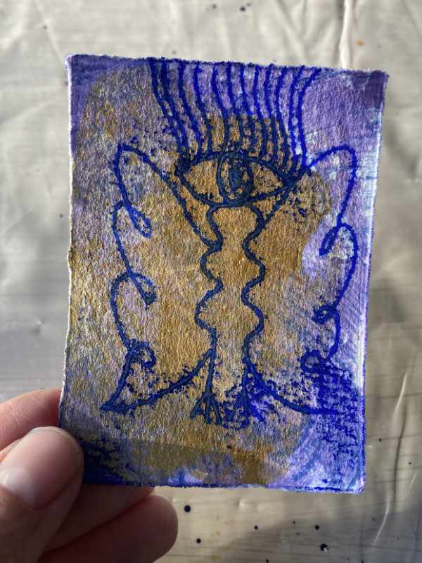 Zweite Auflage mit Lila und Gold im Hintergrund, nun mit Engel bedruckt. Tabeas Hand.